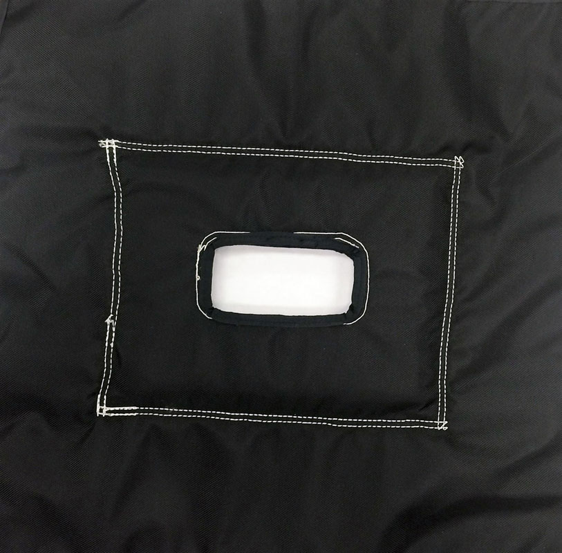 A black bag with a white patch on it.