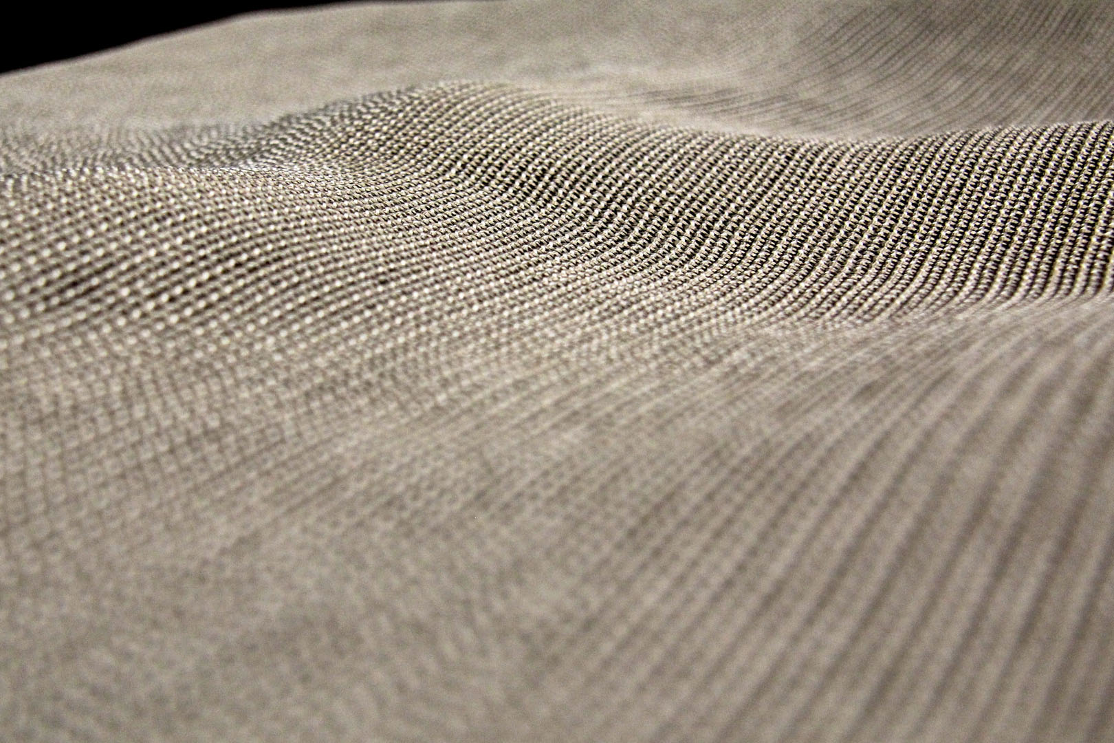 A close up of the fabric surface of a blanket.