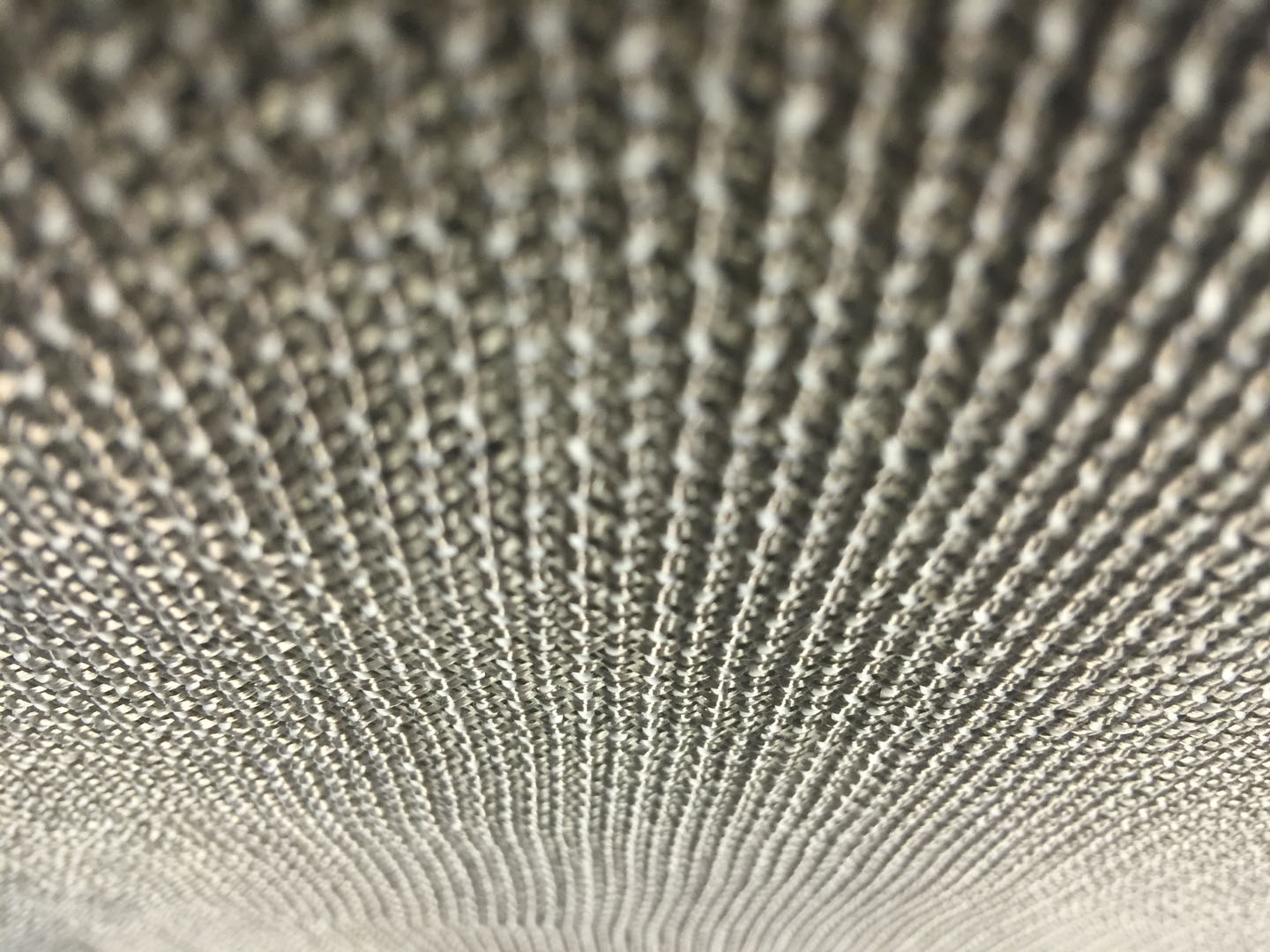 A close up of the top of a silver metal object.